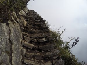 Climb stairs Montana Picchu Peru