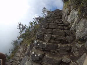 Climb stairs Montana Picchu Peru